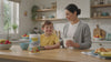 mom and kid in a kitchen enjoying Funbiotics superfood powder 